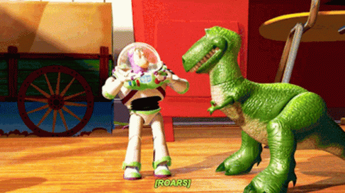Buzz Lightyear Next to Green Toy Dinosaur Saying Roars
