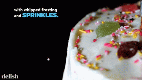 Cake With Whipped Frosting and Sprinkles Saying Delish