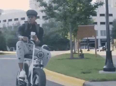 Cam Newton Riding Electric Bike GIF
