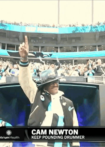 Cam Newton Keep Pounding Drummer Is Shown In A Stadium GIF