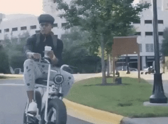 Cam Newton Riding Electric Bike GIF