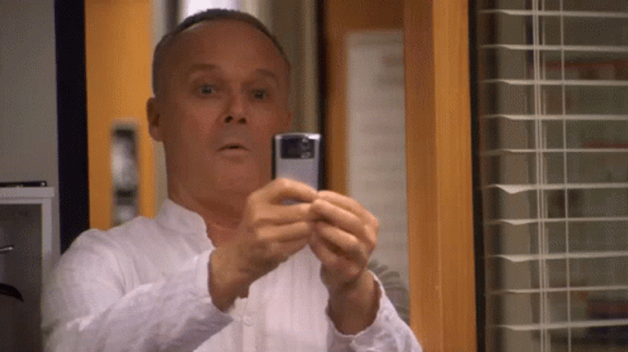 Camera phone Creed The Office gif.