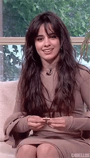 Camila Cabello Holding Famous Amos Cookie GIF