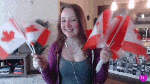 Happy Lady Waving Flags From Canada GIF