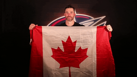 Canada Day Hockey Player Waving Canadian Flag GIF