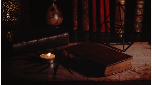 Candle Next To Book Saying A GIF