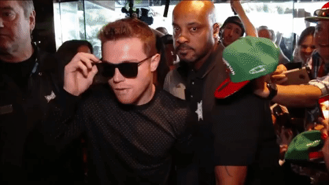 Canelo Álvarez Taking Off Sunglass Walking With Security GIF