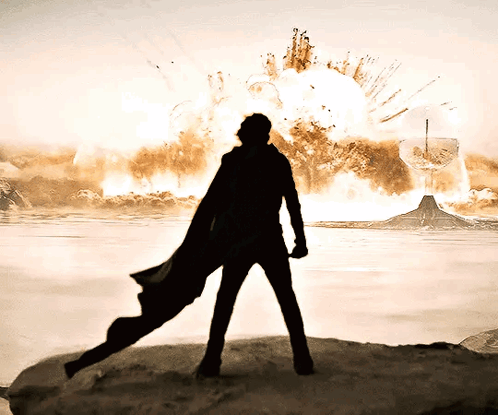 Caped Man Silhouette Explosion GIF
