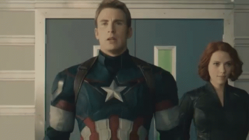 Captain America And Black Widow Are Standing Next To Each Other In A Hallway GIF