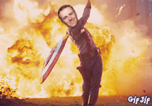 Captain America Holding Shield In Front Of Explosion GIF