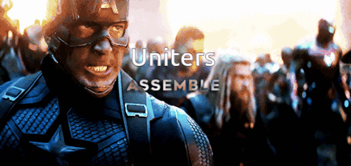 Captain America Stands In Front Of A Group Of People With The Words Uniters Assemble Above Him GIF