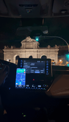 Car Dashboard With Phone and Radio Saying Shagiata