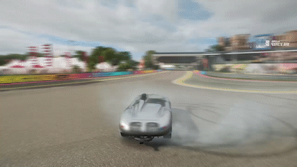 Car Drifting on Race Track With Ferrari Billboard