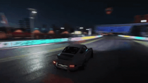 Car Driving at Night with No Trucks Sign