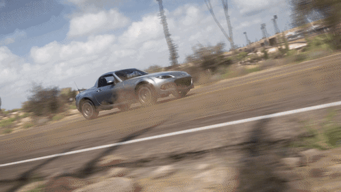 Car Driving Down Dirt Road GIF