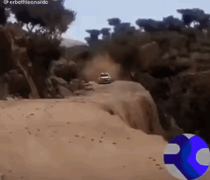 Car Driving Down Dirt Road
