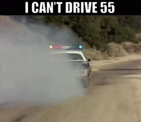 Car Driving Down Dirt Road With Smoke