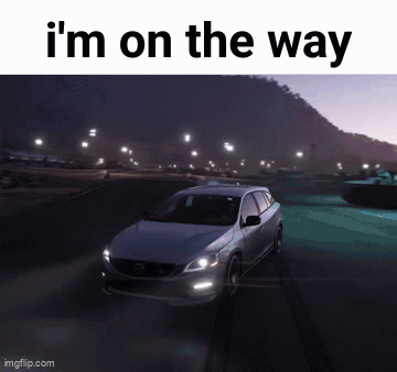 Car Driving Down Road at Night Saying I'm on the Way