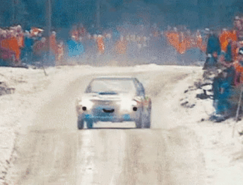 Car Driving Down Snowy Road