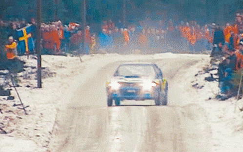 Car Driving Down Snowy Road