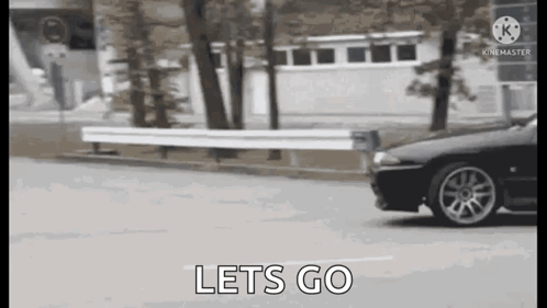Car Driving Down Street Lets Go