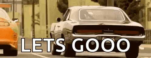 Car Driving Down Street Saying Lets Goooo