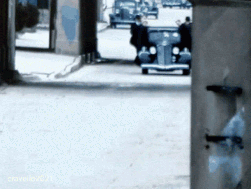 Car Driving Down Street With Cravello2021 Sign GIF
