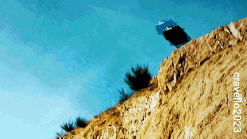 Car Driving Off Cliff And Blowing Up GIF