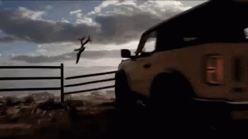 Car Driving Off Cliff During A Race GIF