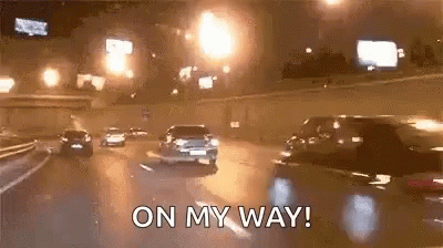 Car Driving on Highway at Night