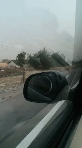 Car Driving on Highway Rear View Mirror