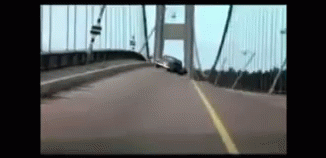 Car Driving Over Bridge in Blurry Video