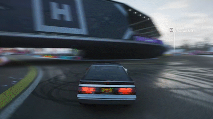 Car Driving Past Billboard Festival Site