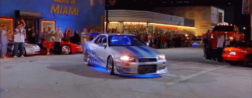 Car Driving Past Miami Building