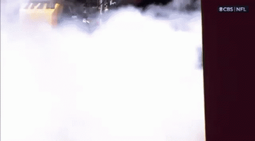 Car Driving Through Smoke on Road