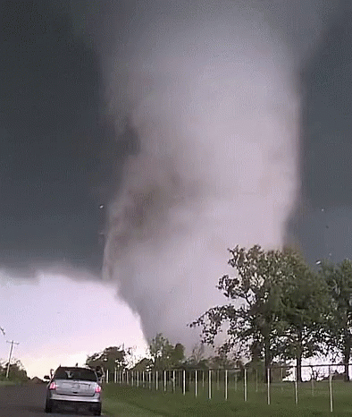 Car Driving Toward Tornado GIF