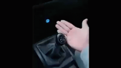 Car Flying Through Air In Front Of Building GIF