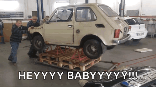 Car on Wooden Pallet Saying Heyyyy Babyyyy