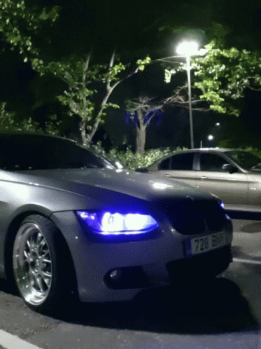 Car With License Plate 728 Parked At Night GIF