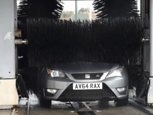 Car With License Plate AV64 RAX in Car Wash