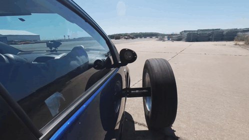 Car With Tire Attached Parked in Lot