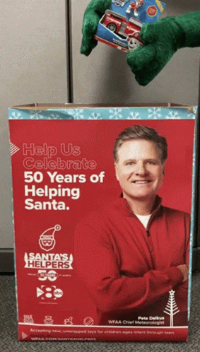 Cardboard Box Saying Help Us Celebrate 50 Years of Helping Santa
