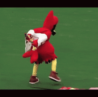 Cardinal Mascot Running on Field