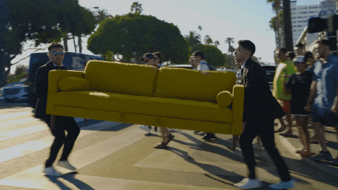 Carrying Yellow Couch Across The Street GIF