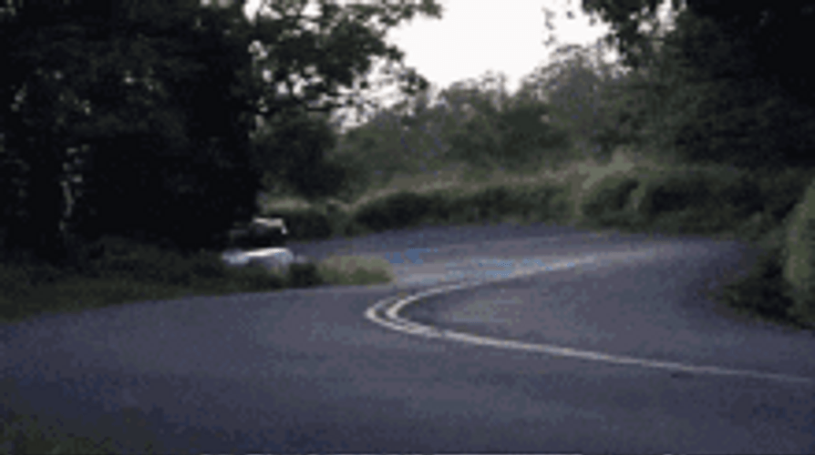 Cars Drifting On Winding Road GIF