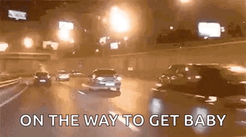 Cars Driving Down Highway At Night On The Way To Get Baby GIF