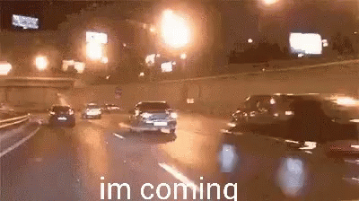 Cars Driving Down Highway At Night GIF