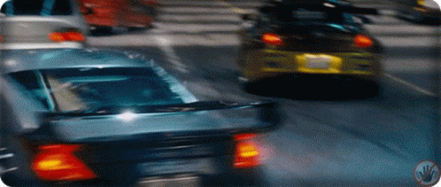 Cars Driving on Street with License Plate AA