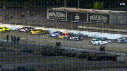 Cars Racing on Race Track at Night