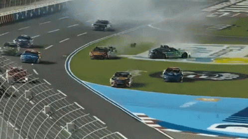 Cars Racing on Track With Ford Sticker